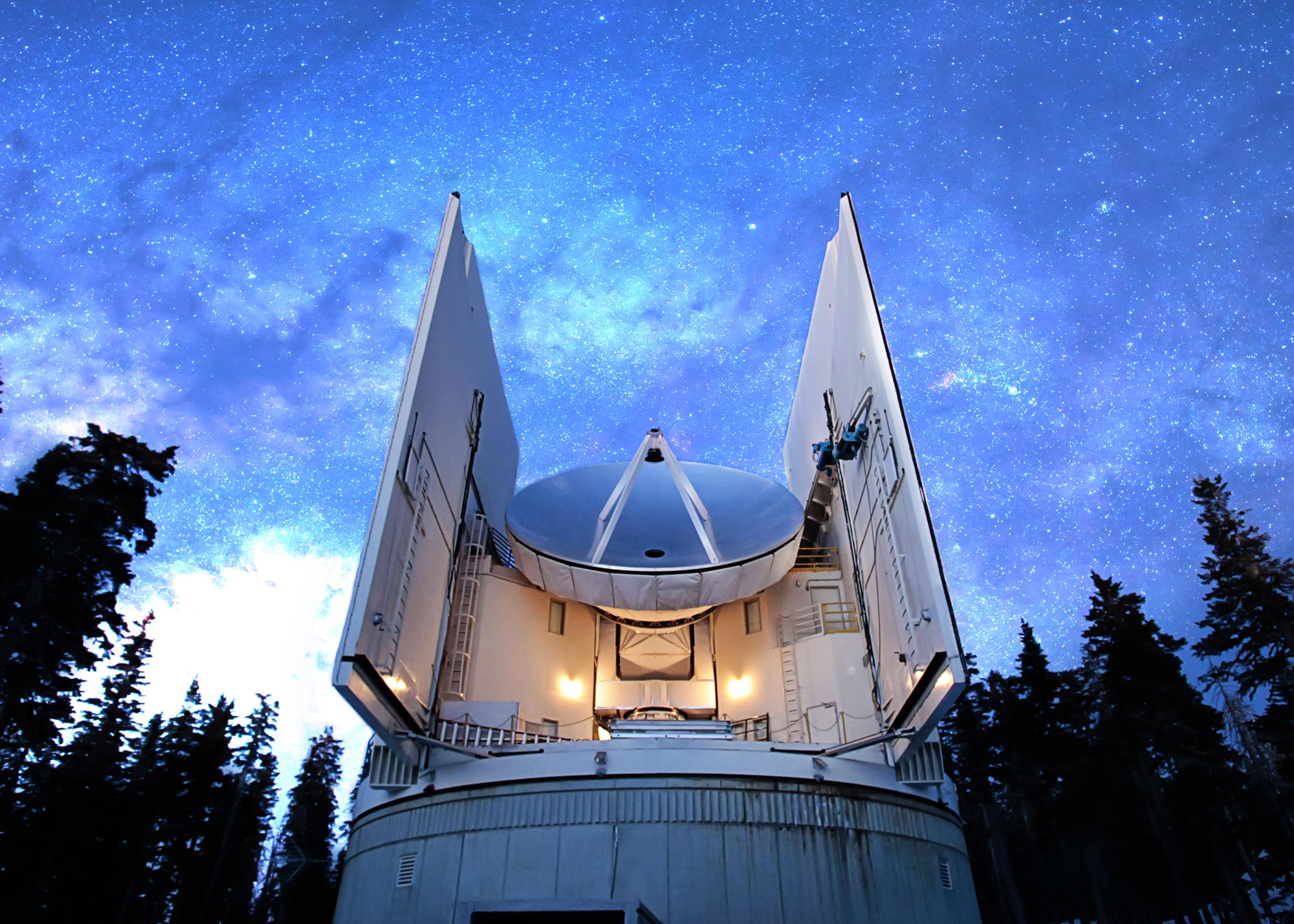 The Submillimeter Telescope under the night sky.