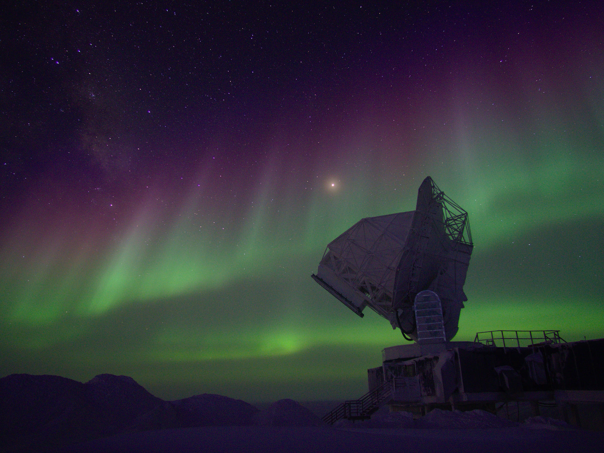 The South Pole Telescope observing under polar lights.